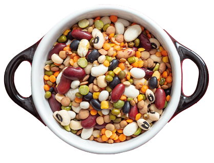 Healthy diet concept  Assortment of legumes in enameled bowl on red background, isolated, top view, copy space 